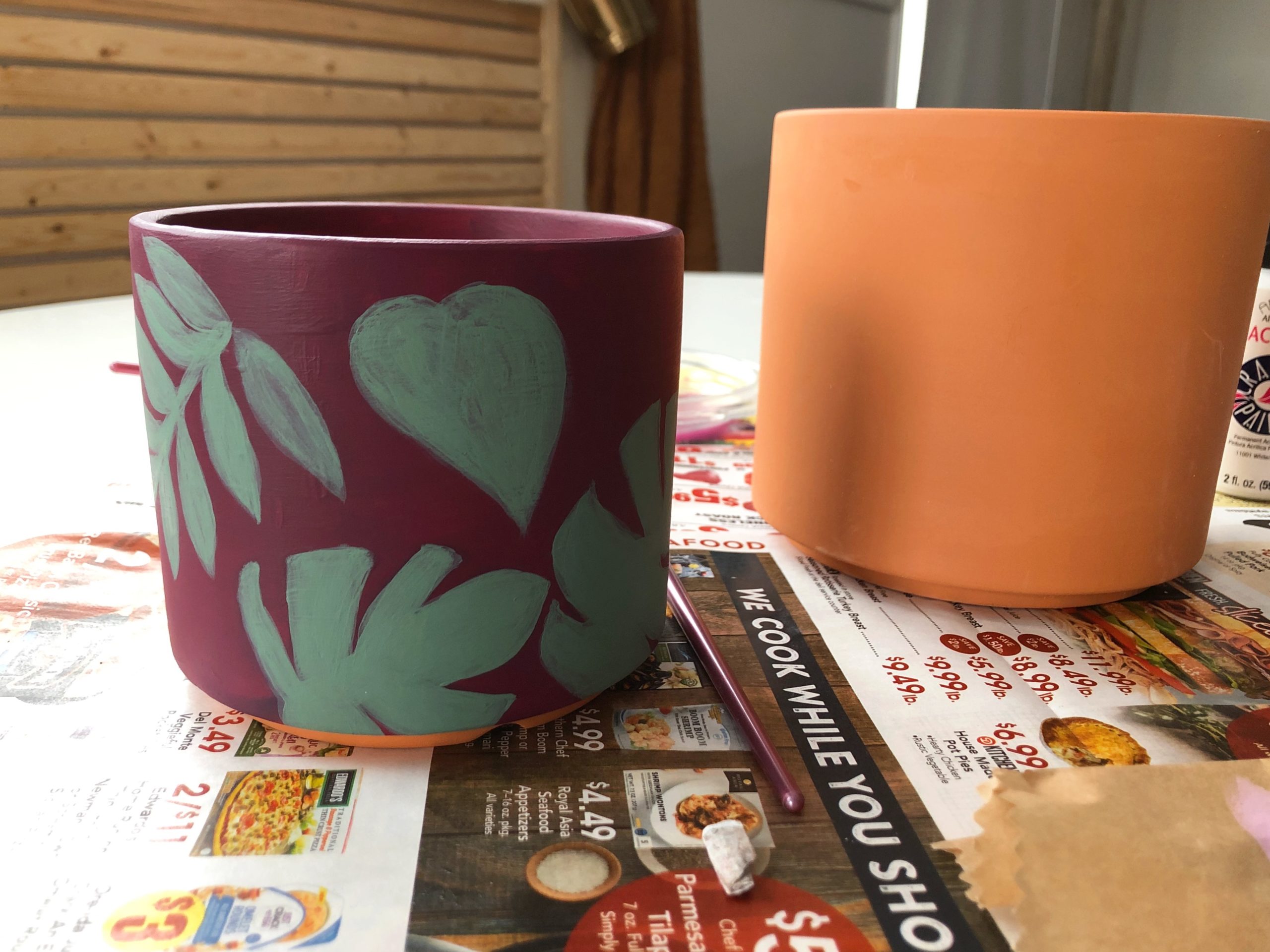 adding layers of paint to your terracotta pot