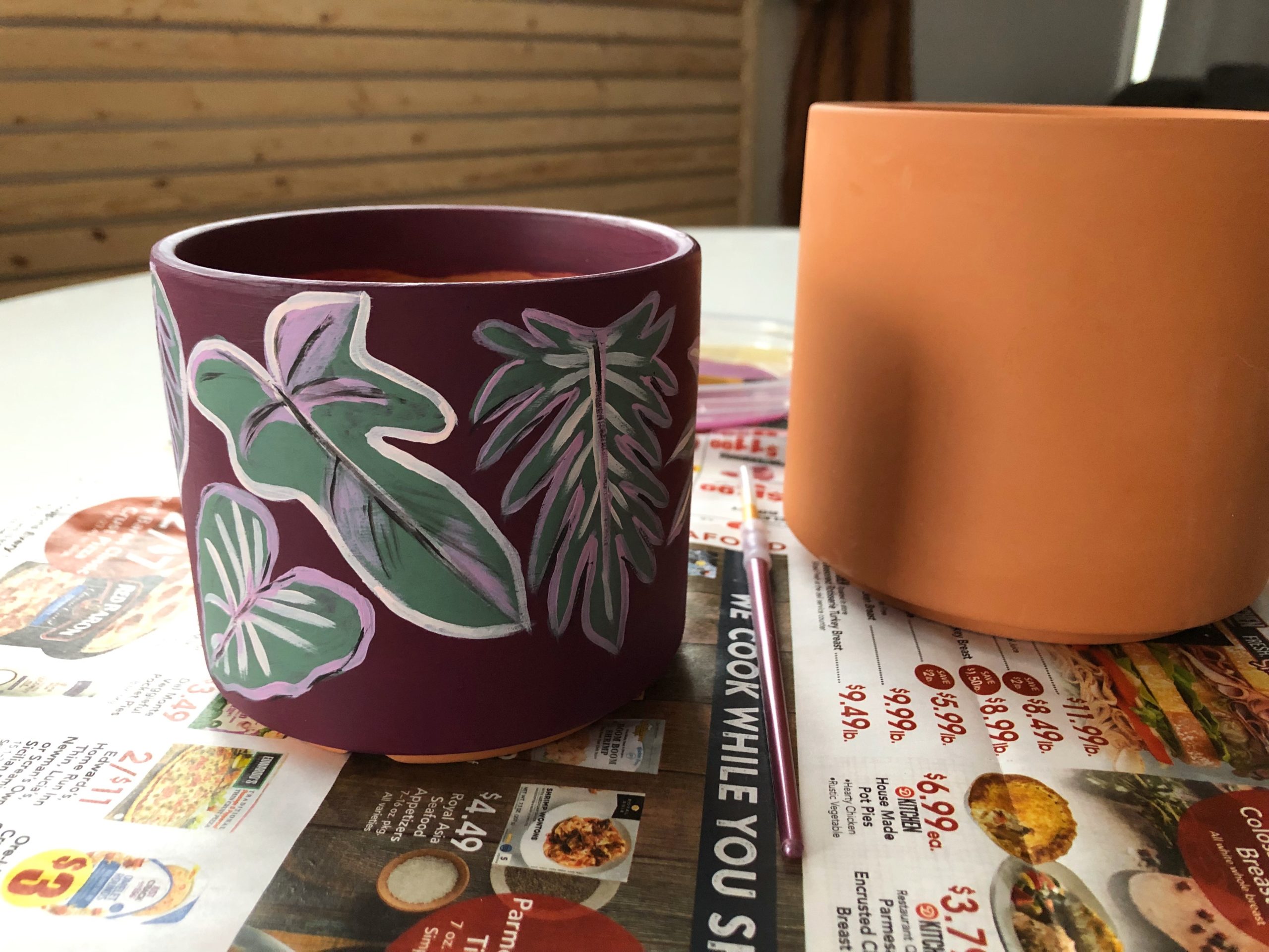 adding layers of paint to your terracotta pot